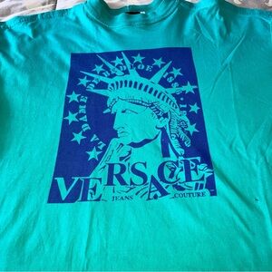 Versace Men’s XL Vintage Tee with Lady Liberty in navy on green shirt.